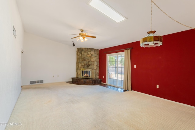 2232 Carmelita Dr, Sierra Vista, AZ 85635 - unfurnished living room featuring a fireplace, carpet, visible vents, and a ceiling fan