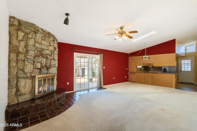2232 Carmelita Dr, Sierra Vista, AZ 85635 - unfurnished living room with ceiling fan, lofted ceiling, a stone fireplace, and carpet floors