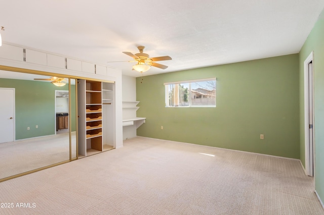 2232 Carmelita Dr, Sierra Vista, AZ 85635 - unfurnished bedroom with a closet, baseboards, a ceiling fan, and carpet