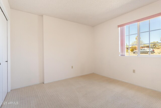 2232 Carmelita Dr, Sierra Vista, AZ 85635 - unfurnished room with carpet floors and a textured ceiling