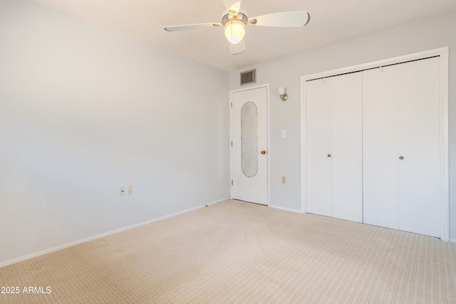 2232 Carmelita Dr, Sierra Vista, AZ 85635 - unfurnished bedroom with visible vents, baseboards, a closet, a ceiling fan, and light colored carpet