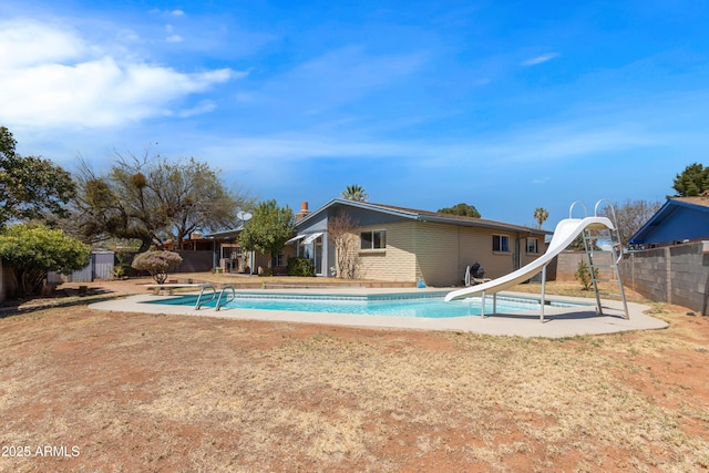 2232 Carmelita Dr, Sierra Vista, AZ 85635 - view of pool with a fenced in pool, a patio area, fence, and a water slide