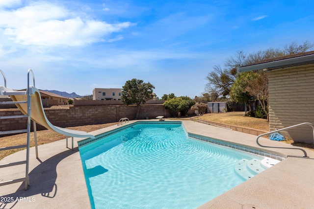 2232 Carmelita Dr, Sierra Vista, AZ 85635 - view of pool with a diving board, a fenced backyard, a water slide, a patio, and a fenced in pool