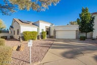 view of front of property featuring a garage and concrete driveway