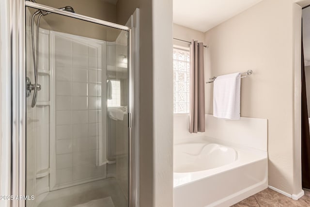 5840 E Holmes Ave, Mesa, AZ 85206 - full bath with a shower stall, a garden tub, tile patterned flooring, and baseboards