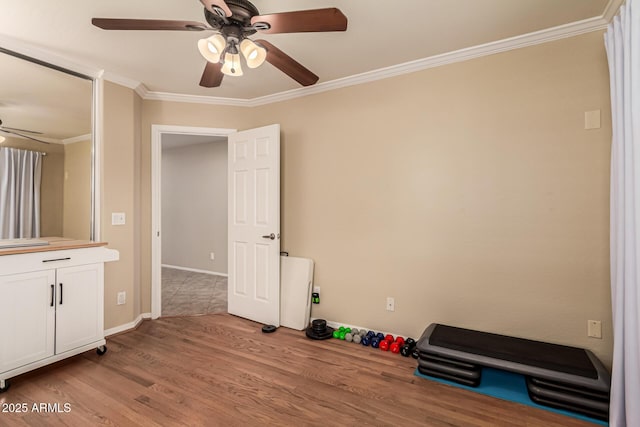 5840 E Holmes Ave, Mesa, AZ 85206 - exercise area with a ceiling fan, ornamental molding, light wood-type flooring, and baseboards