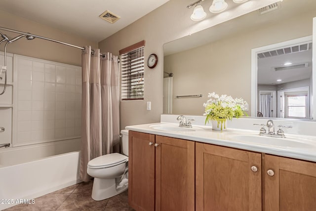 5840 E Holmes Ave, Mesa, AZ 85206 - bathroom with toilet, double vanity, shower / bath combo, and tile patterned flooring