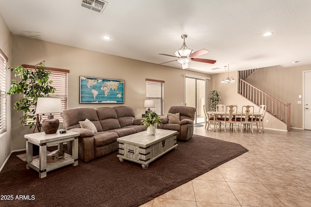 5840 E Holmes Ave, Mesa, AZ 85206 - living room featuring ceiling fan, healthy amount of natural light, recessed lighting, light tile patterned flooring, and stairway