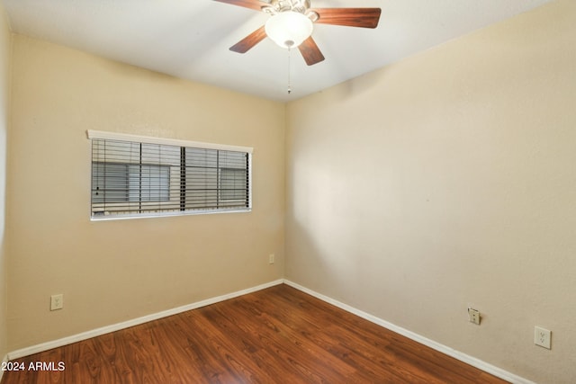 empty room featuring ceiling fan and hardwood / wood-style flooring