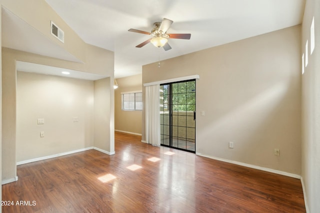 empty room with ceiling fan and wood-type flooring