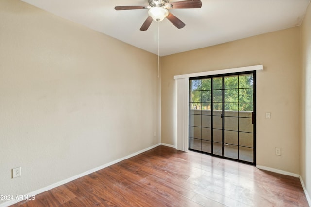 spare room featuring ceiling fan and light hardwood / wood-style flooring