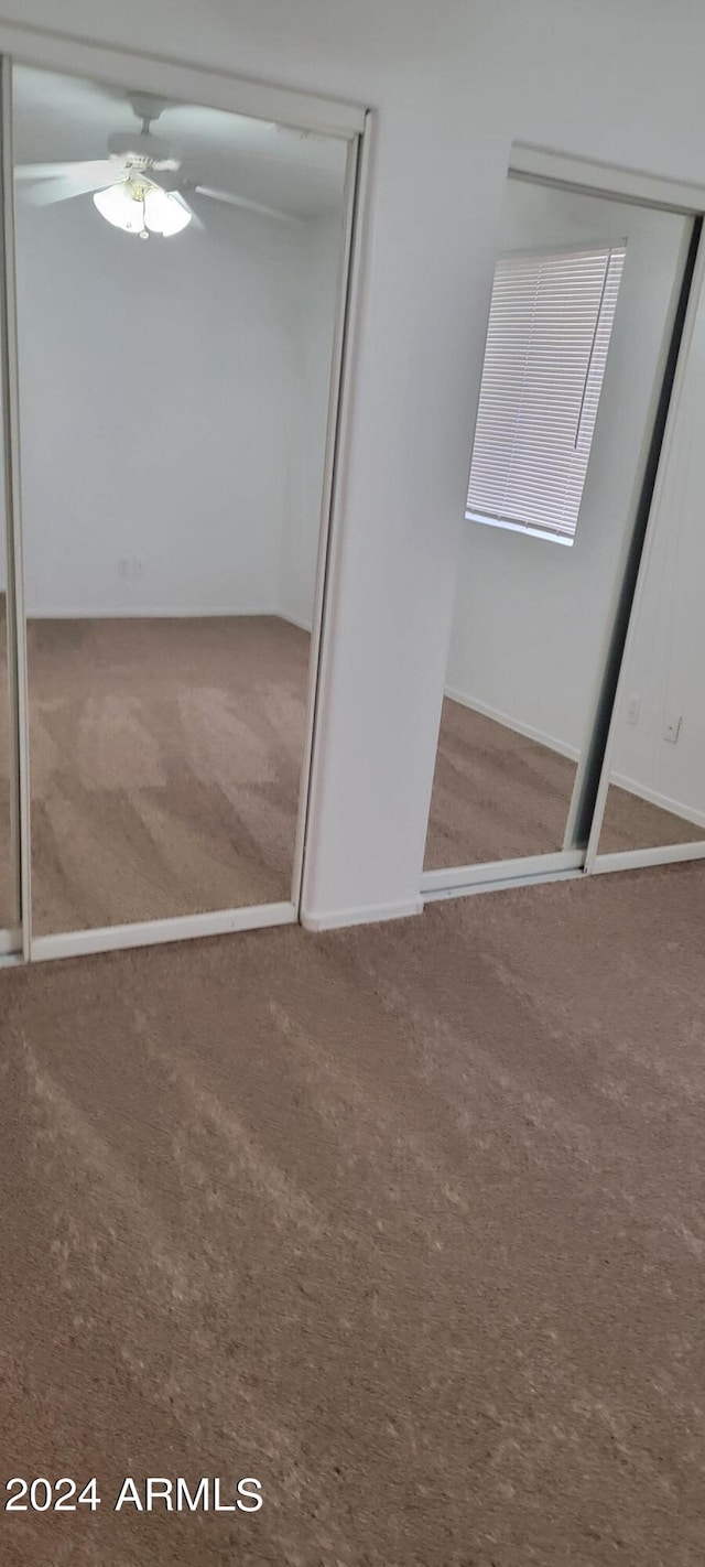 16021 N 30th St Unit 113, Phoenix, AZ 85032 - unfurnished bedroom featuring carpet flooring, a closet, and ceiling fan