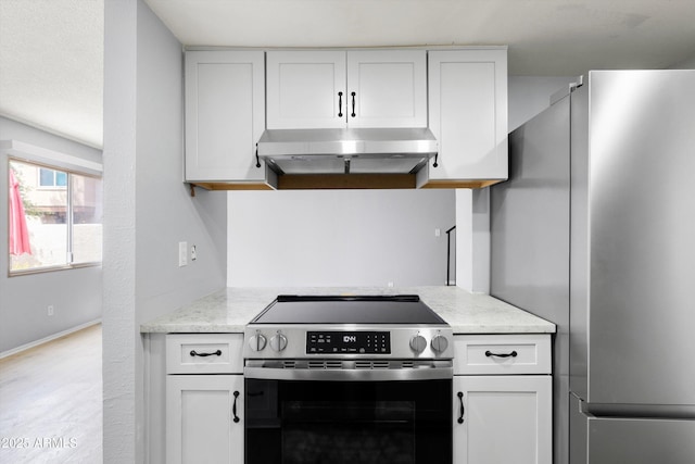 kitchen with light stone countertops, baseboards, white cabinetry, under cabinet range hood, and appliances with stainless steel finishes