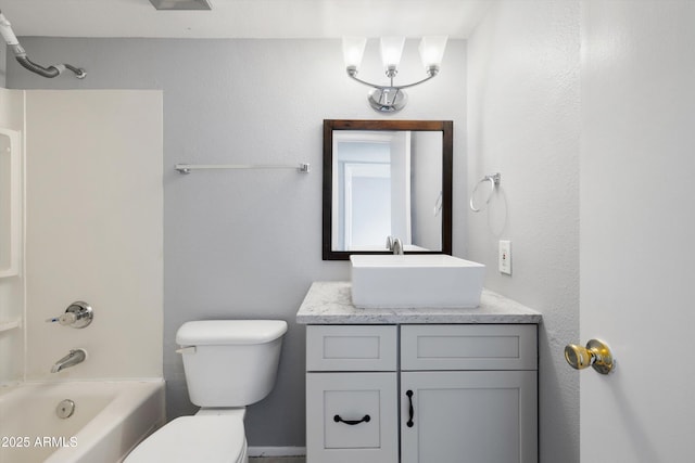 bathroom with shower / bath combination, vanity, and toilet