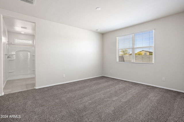 1343 W Hess Ave, Coolidge, AZ 85128 - carpeted empty room with baseboards