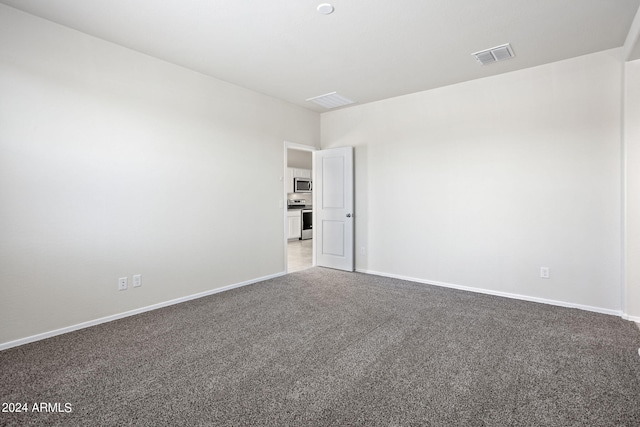 1343 W Hess Ave, Coolidge, AZ 85128 - carpeted empty room featuring baseboards and visible vents