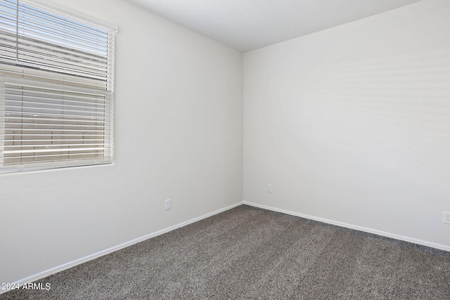 1343 W Hess Ave, Coolidge, AZ 85128 - carpeted empty room featuring baseboards