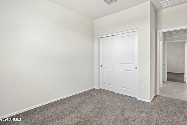 1343 W Hess Ave, Coolidge, AZ 85128 - unfurnished bedroom featuring baseboards, visible vents, and carpet