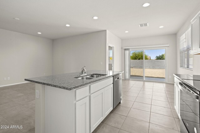 1343 W Hess Ave, Coolidge, AZ 85128 - kitchen with light stone counters, a sink, a center island with sink, stainless steel appliances, and visible vents