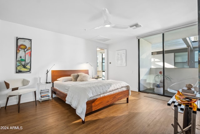 bedroom featuring wood-type flooring, access to outside, and ceiling fan