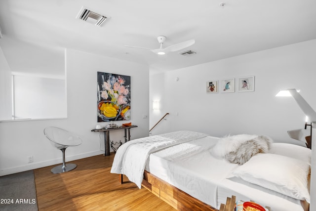 bedroom featuring ceiling fan and hardwood / wood-style floors