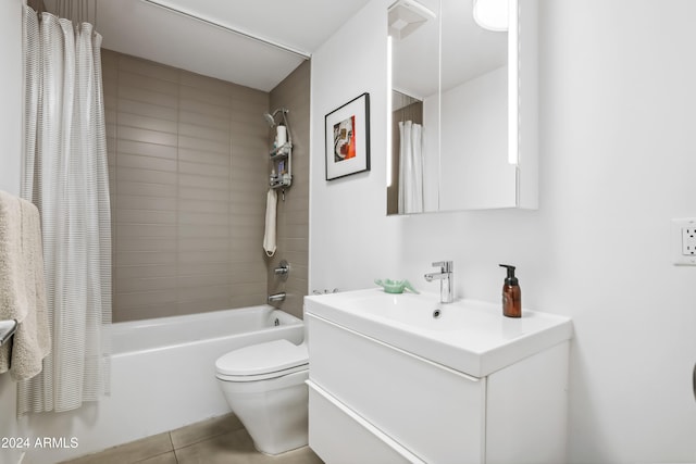 full bathroom featuring shower / bath combination with curtain, tile patterned flooring, vanity, and toilet