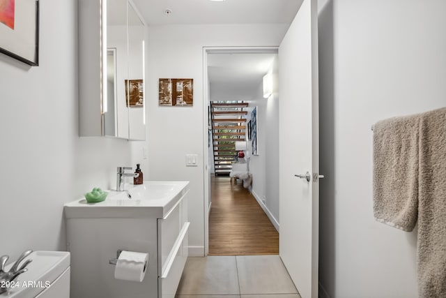 bathroom with vanity, hardwood / wood-style flooring, and toilet