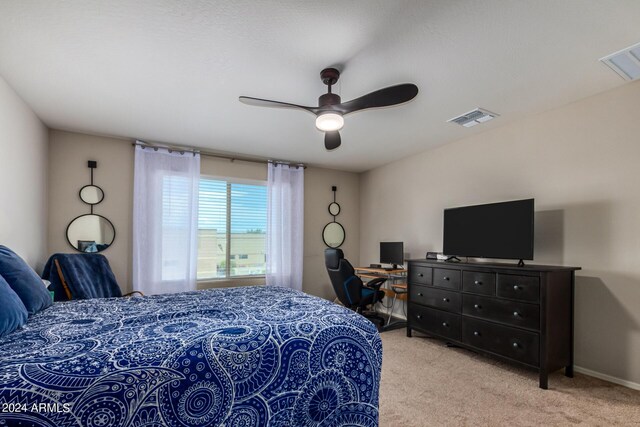 sitting room featuring light carpet and ceiling fan