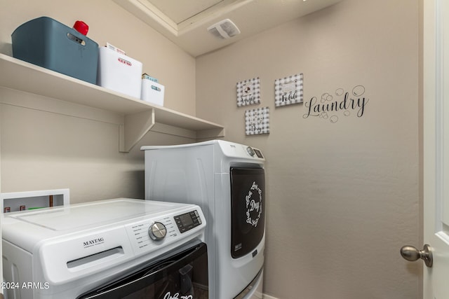 laundry room featuring washer and clothes dryer