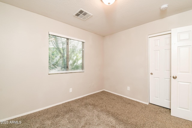 24163 N Cotton Cir, Florence, AZ 85132 - unfurnished bedroom featuring carpet, baseboards, and a closet