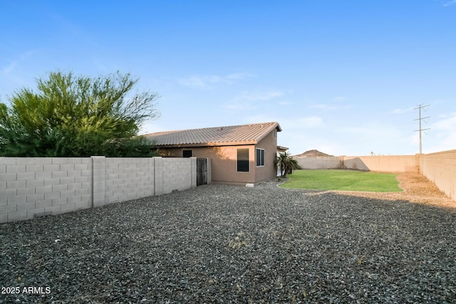 24163 N Cotton Cir, Florence, AZ 85132 - rear view of property featuring a tile roof and stucco siding