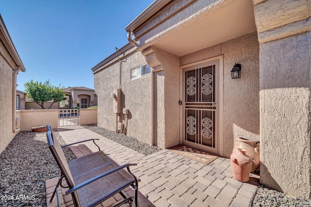 property entrance with a patio