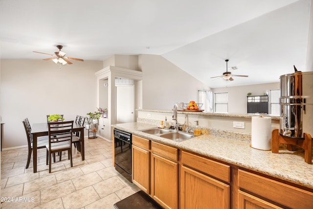 kitchen featuring ceiling fan, vaulted ceiling, black dishwasher, and sink