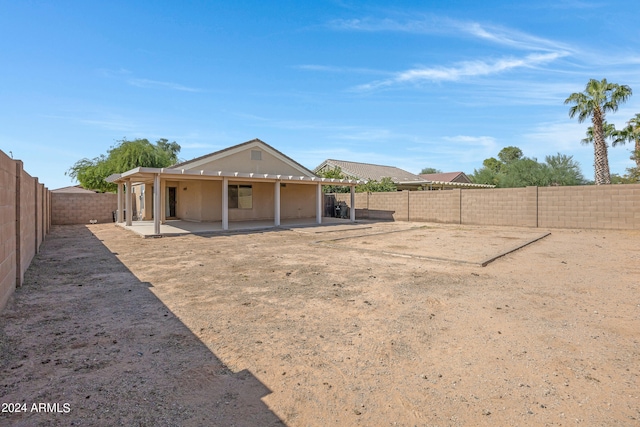 back of property with a patio