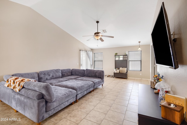 living room with light tile patterned flooring, ceiling fan, and vaulted ceiling