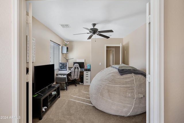 bedroom featuring ceiling fan and carpet