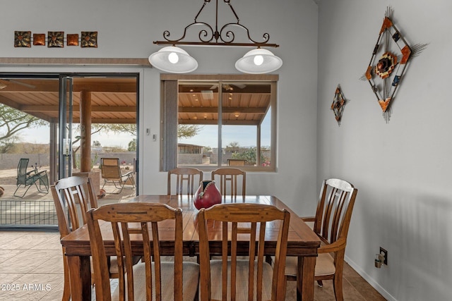 dining area featuring tile patterned flooring