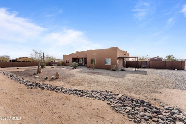 back of property with a patio area