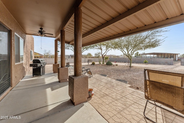 view of patio with ceiling fan and grilling area