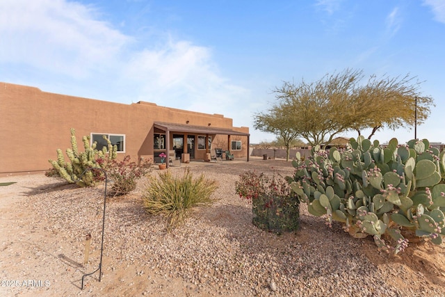 rear view of house featuring a patio