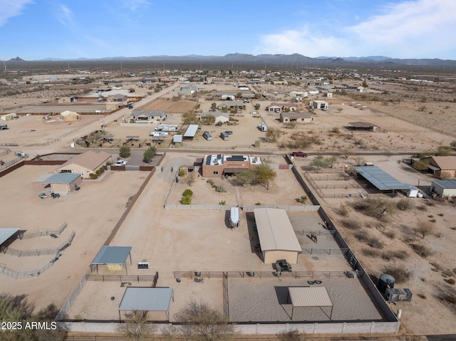 birds eye view of property with a mountain view