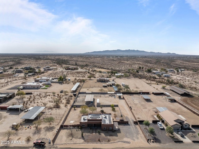 birds eye view of property with a mountain view