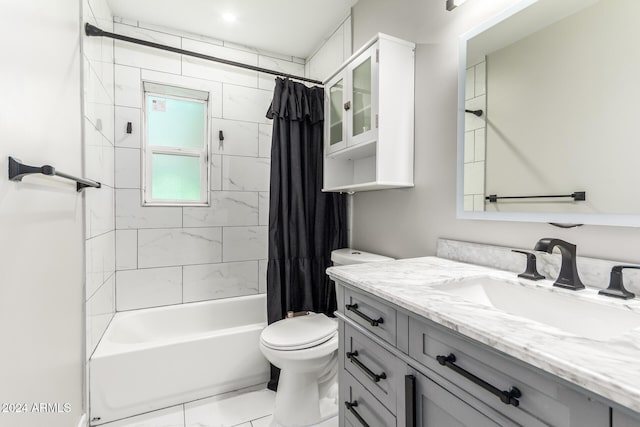 full bathroom featuring vanity, tile patterned floors, toilet, and shower / tub combo with curtain