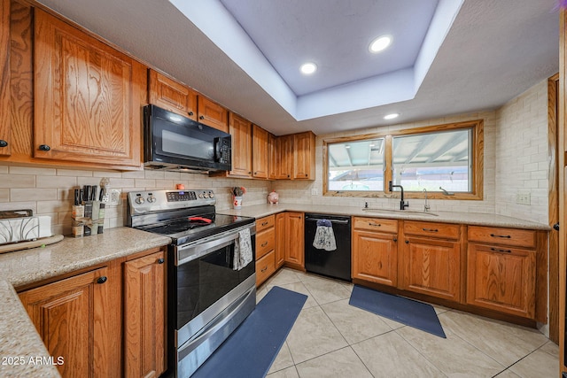 14412 N 39th Ave, Phoenix, AZ 85053 - kitchen featuring black appliances, a sink, tasteful backsplash, brown cabinetry, and recessed lighting