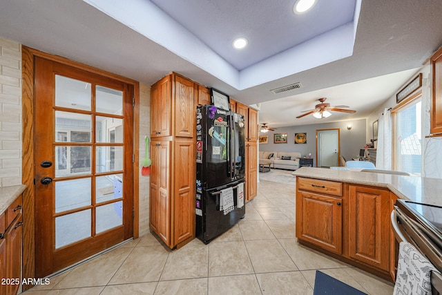 14412 N 39th Ave, Phoenix, AZ 85053 - kitchen featuring freestanding refrigerator, electric range, a ceiling fan, light tile patterned flooring, and open floor plan