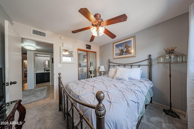 14412 N 39th Ave, Phoenix, AZ 85053 - carpeted bedroom featuring ceiling fan, a closet, and baseboards