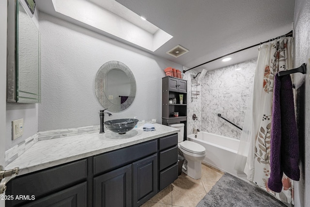14412 N 39th Ave, Phoenix, AZ 85053 - bathroom with shower / bath combo with shower curtain, toilet, vanity, tile patterned flooring, and a skylight