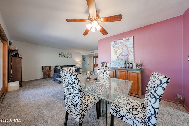 14412 N 39th Ave, Phoenix, AZ 85053 - dining area featuring light carpet, a ceiling fan, and baseboards