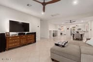 14687 W Amelia Ave, Goodyear, AZ 85395 - living room featuring ceiling fan and recessed lighting