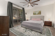14687 W Amelia Ave, Goodyear, AZ 85395 - bedroom with ceiling fan